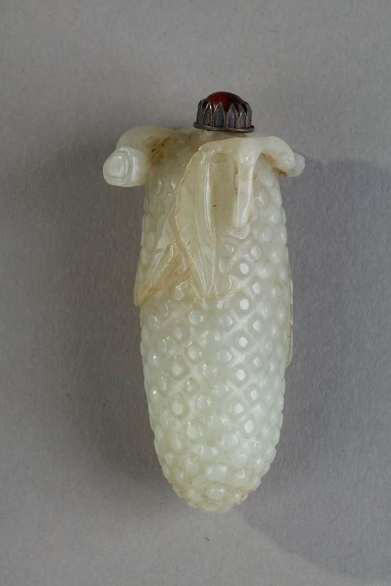 Nephrite jade snuffbottle carved in the shape of fruit branch in high relief and leaves around the opening of the bottle   - China 19th century | MasterArt